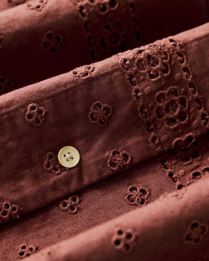 material shot of the buttons and eyelet on The Hawthorne Shirt in Red Wine Border Eyelet