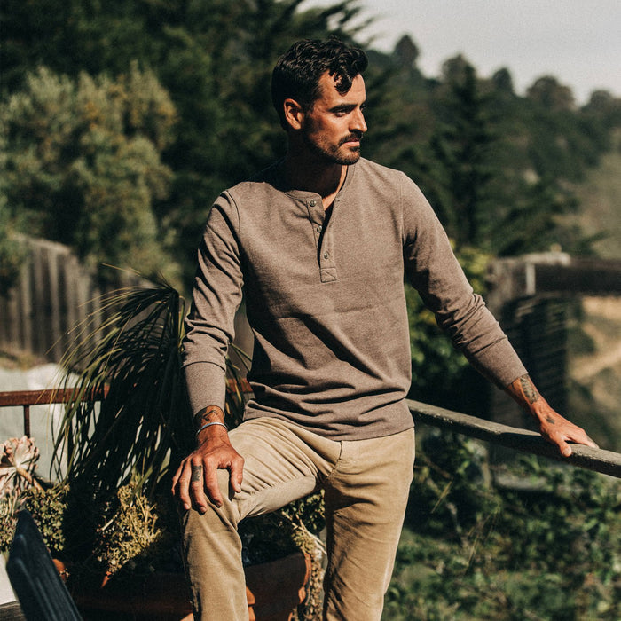 fit model wearing The Heavy Bag Henley in Espresso, looking right