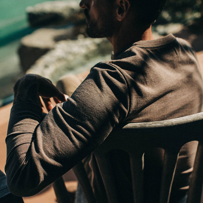 fit model wearing The Heavy Bag Henley in Espresso, sleeve detail