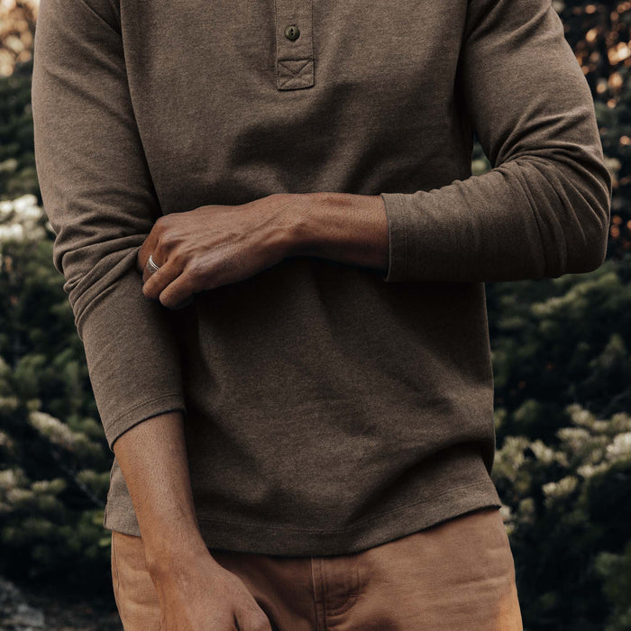 fit model adjusting sleeves on The Heavy Bag Henley in Walnut