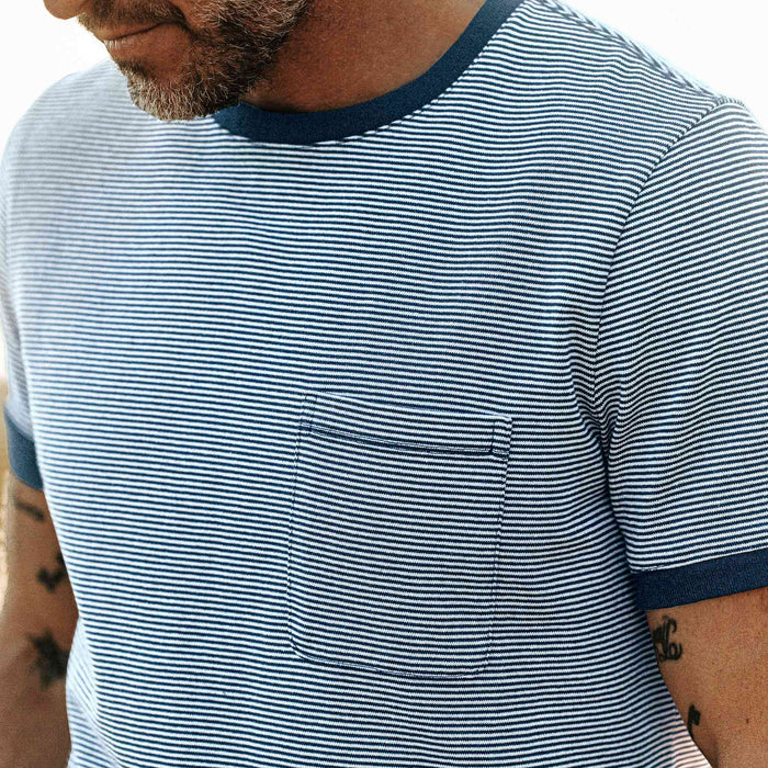a close up shot of our fit model wearing The Heavy Bag Ringer in Royal Blue Stripe out in the desert at sunset