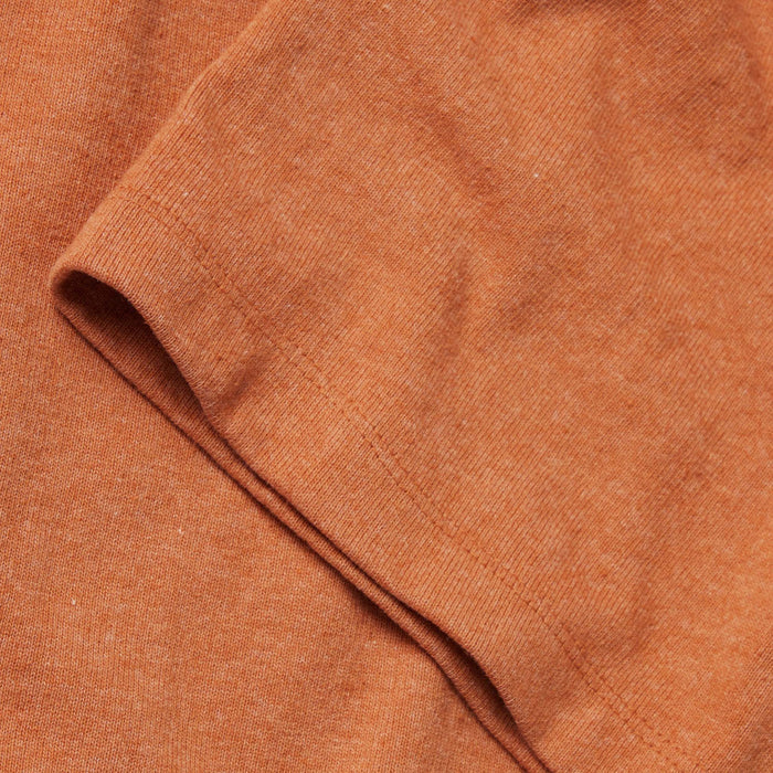 material shot of the sleeves on The Heavy Bag Tee in Apricot