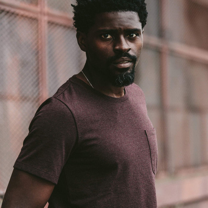 The fit model wearing the burgundy heavy bag tee