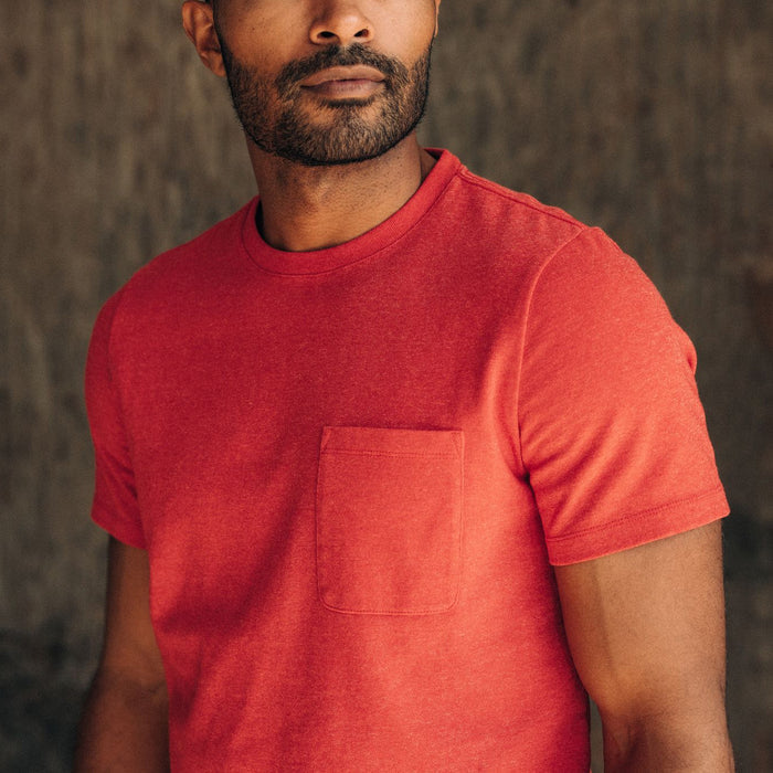 fit model showing the front chest pocket on The Heavy Bag Tee in Cardinal