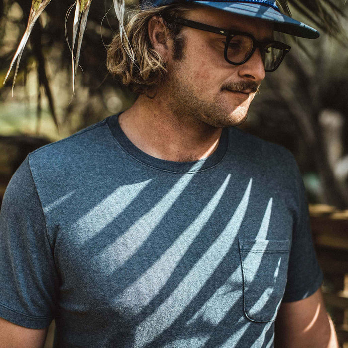The fit model wearing The Heavy Bag Tee in Dusty Blue from Taylor Stitch.