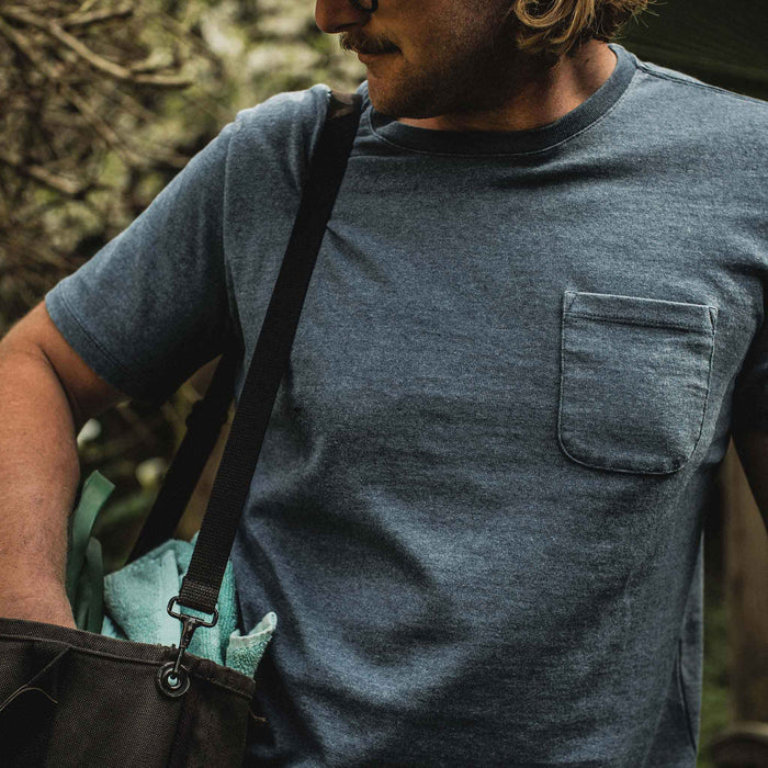 The fit model wearing The Heavy Bag Tee in Dusty Blue from Taylor Stitch.