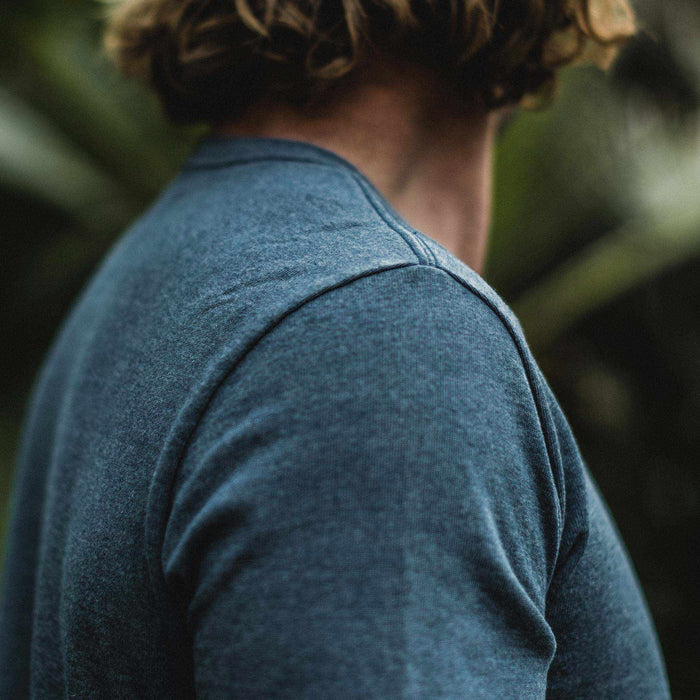 The fit model wearing The Heavy Bag Tee in Dusty Blue from Taylor Stitch.