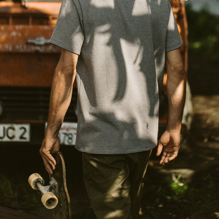 Our fit model wearing The Heavy Bag Tee in Grey Stripe.
