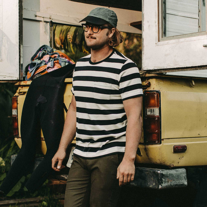 Our fit model wearing The Heavy Bag Tee in Natural & Navy Rugby Stripe by Taylor Stitch.