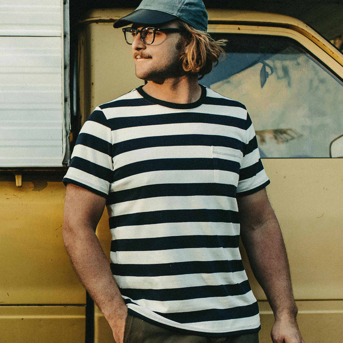 Our fit model wearing The Heavy Bag Tee in Natural & Navy Rugby Stripe by Taylor Stitch.