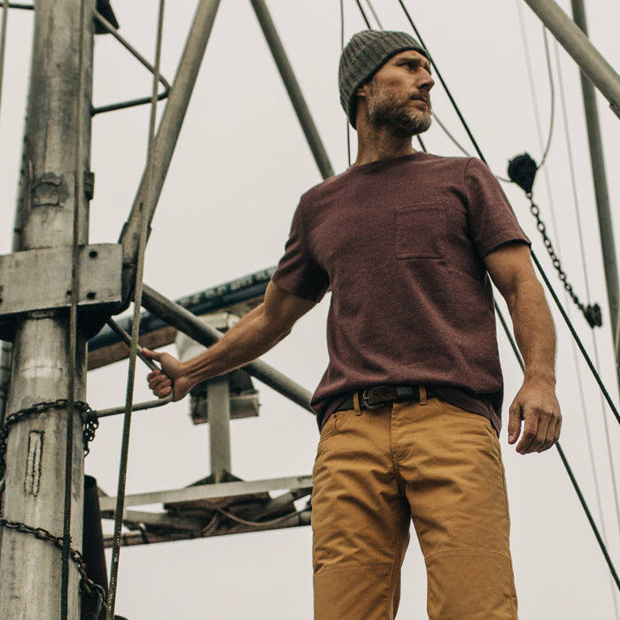 fit model wearing The Heavy Bag Tee in Russet on a boat