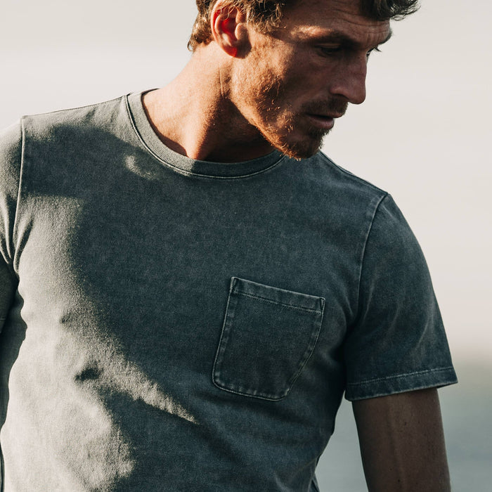 fit model wearing The Heavy Bag Tee in Sea Green, cropped shot looking down