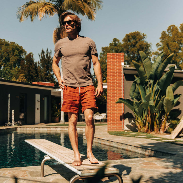 fit model wearing The Heavy Bag Tee in Walnut by the pool
