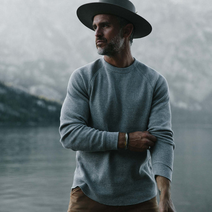 fit model wearing The Heavy Bag Waffle Crewneck in Aluminum in front of a lake