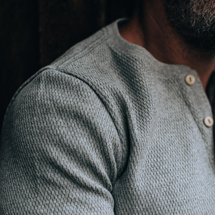 our fit model wearing The Heavy Bag Waffle Henley in Ash—cropped shot of shoulder