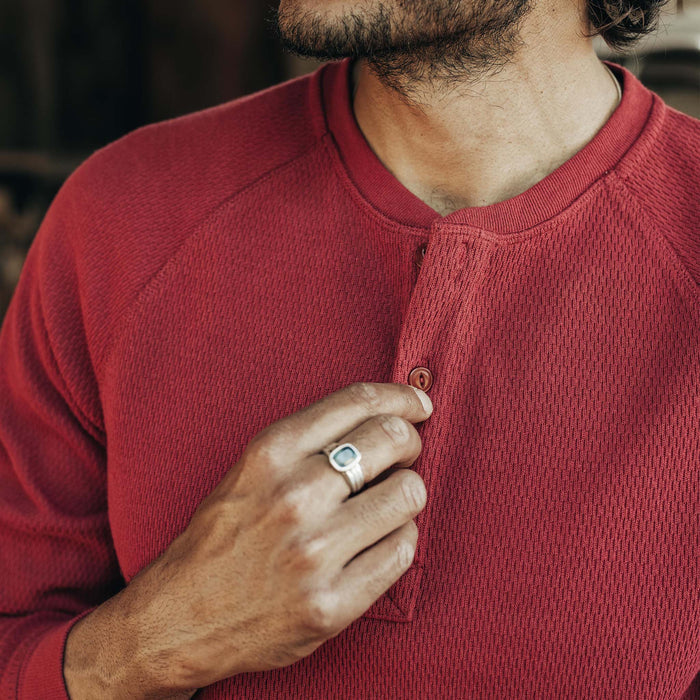fit model adjusting the buttons on The Heavy Bag Waffle Henley in Burgundy