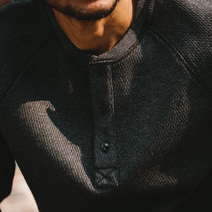 fit model showing front placket of The Heavy Bag Waffle Henley in Coal