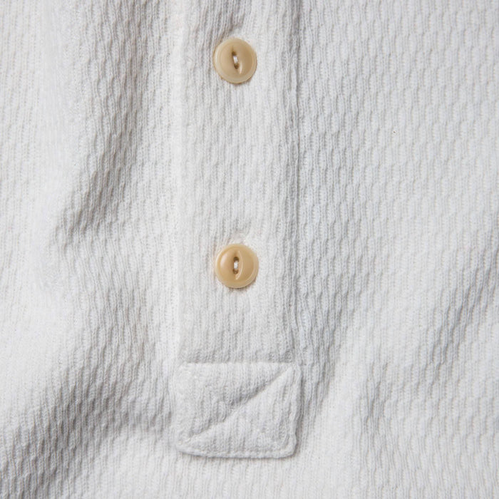 material shot of the placket of The Heavy Bag Waffle Henley in Natural