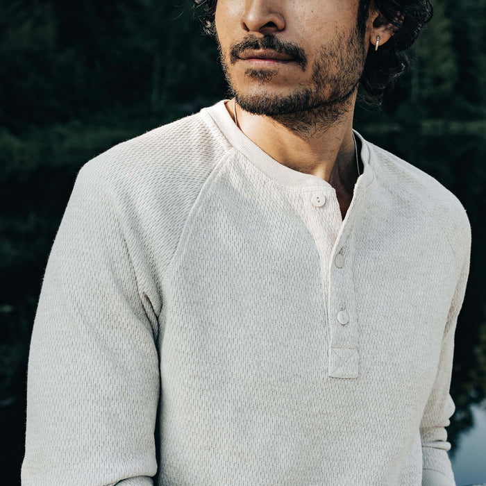 fit model showing off button detail on The Heavy Bag Waffle Henley in Oatmeal
