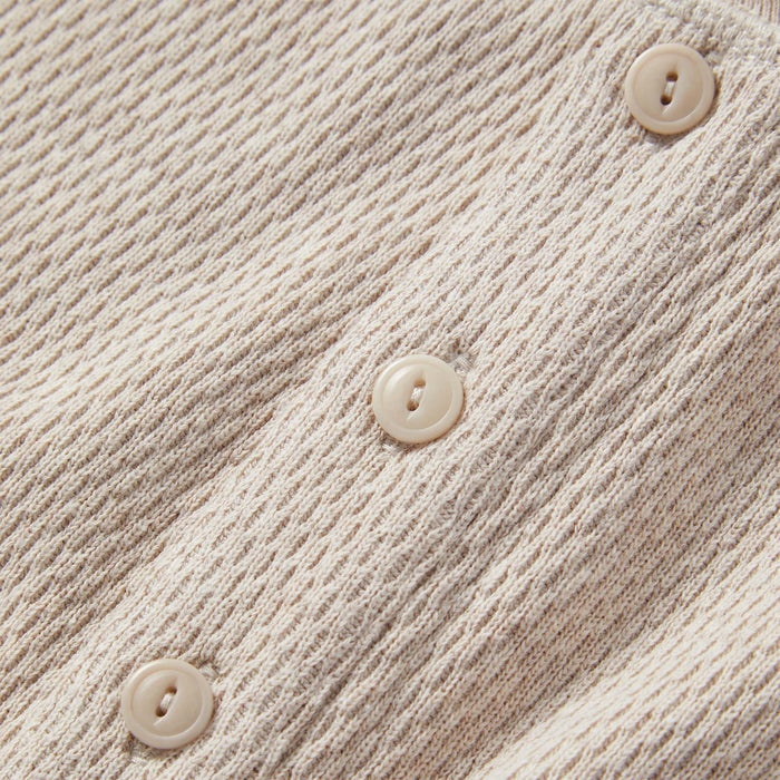 material shot of the buttons on The Heavy Bag Waffle Henley in Oatmeal