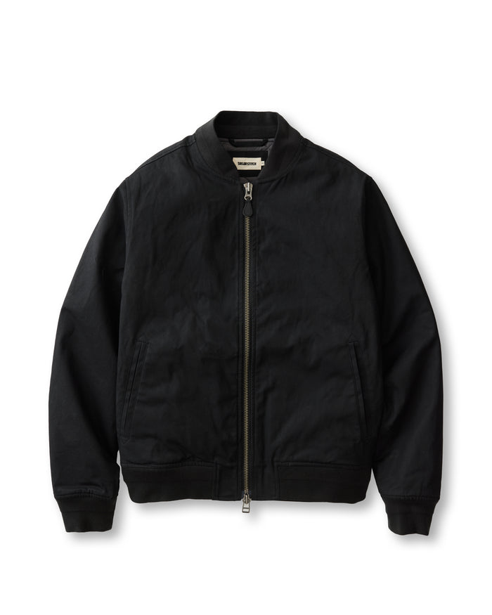 flatlay of The Insulated Bomber Jacket in Coal Dry Wax