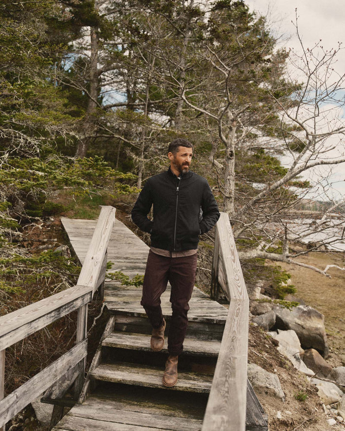fit model showing the front of The Insulated Bomber Jacket in Coal Dry Wax