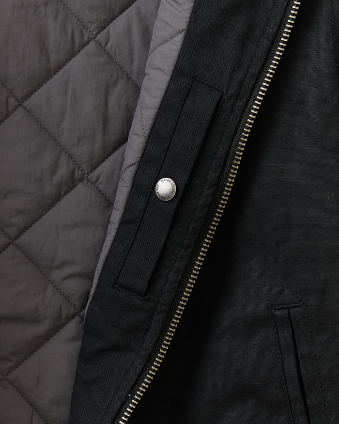 flatlay of The Insulated Bomber Jacket in Coal Dry Wax, shown from the back