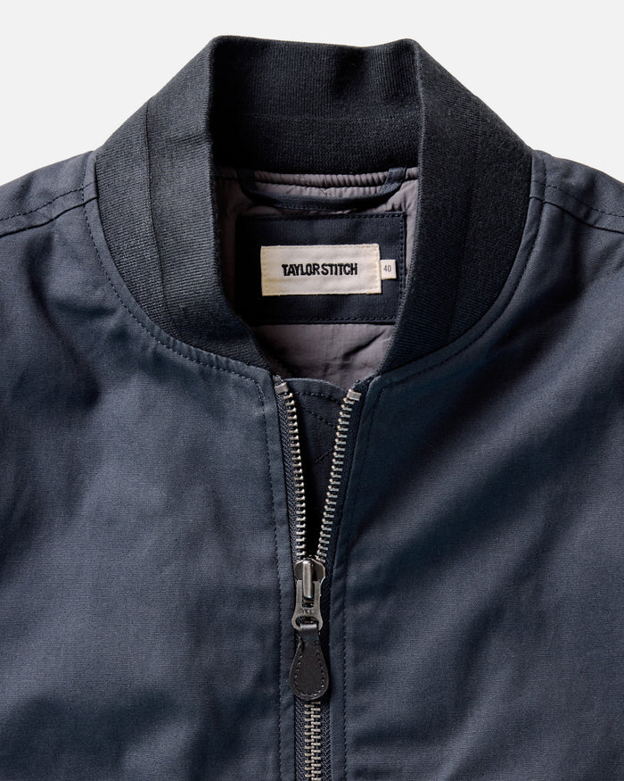 material shot of the collar on The Insulated Bomber Jacket in Dark Navy Dry Wax
