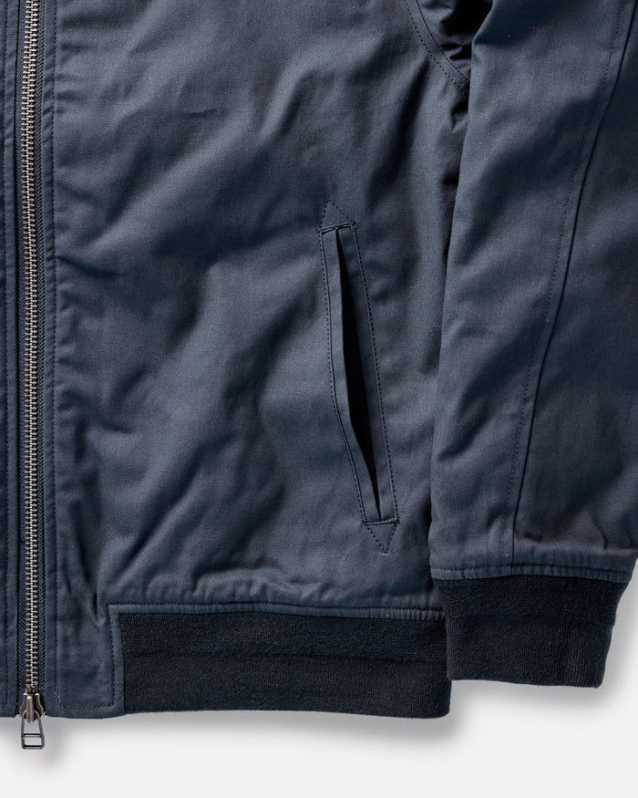material shot of the pockets on The Insulated Bomber Jacket in Dark Navy Dry Wax