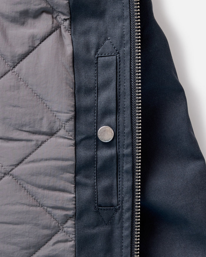 material shot of the inside pocket on The Insulated Bomber Jacket in Dark Navy Dry Wax