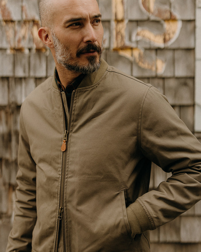 fit model wearing The Insulated Bomber Jacket in Fatigue Olive Dry Wax