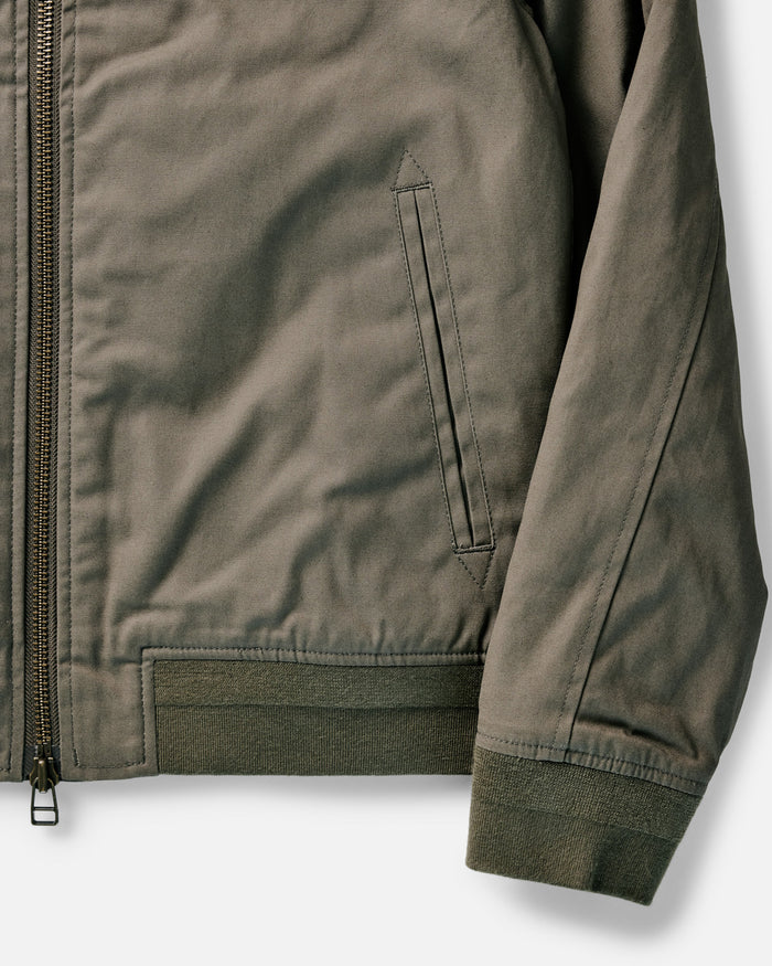 flatlay of The Insulated Bomber Jacket in Fatigue Olive Dry Wax, shown open