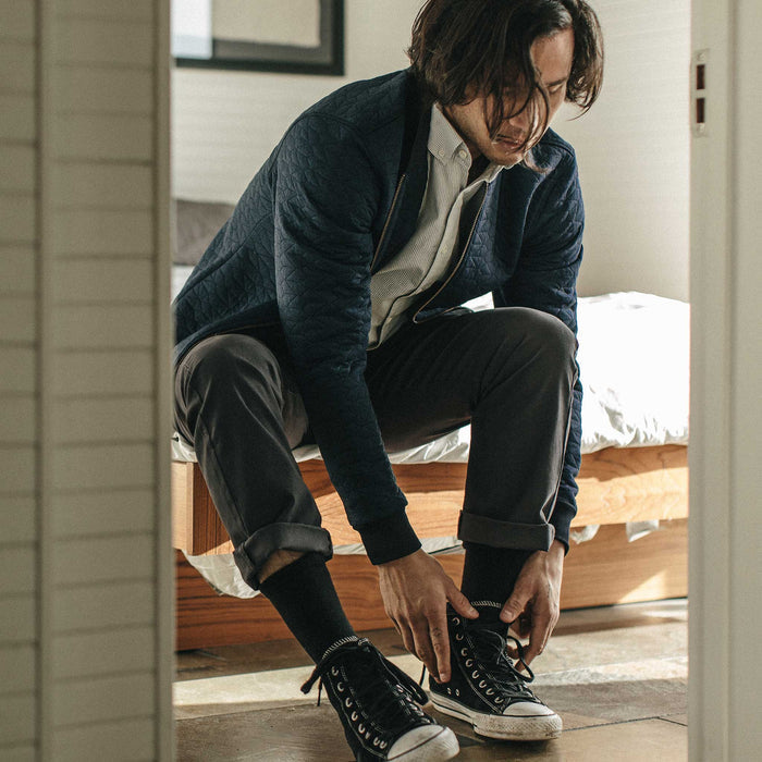 Our fit model wearing The Inverness Bomber in Navy Knit Quilt.