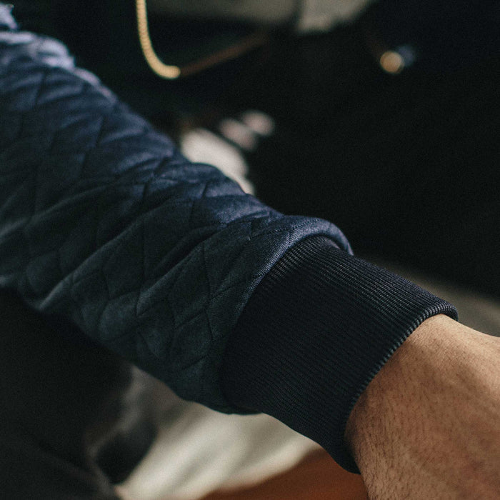 Our fit model wearing The Inverness Bomber in Navy Knit Quilt.