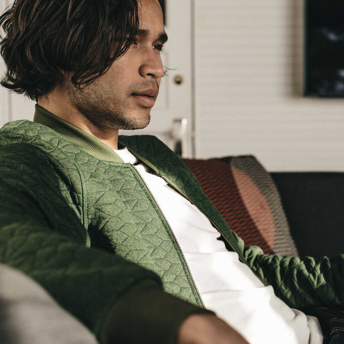Our fit model wearing The Inverness Bomber in Olive Knit Quilt.