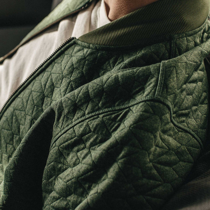 Our fit model wearing The Inverness Bomber in Olive Knit Quilt.