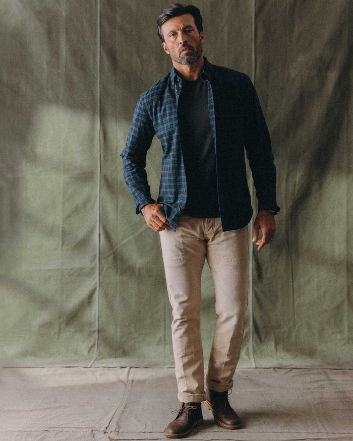 fit model with his arms crossed wearing The Jack in Blackwatch Plaid