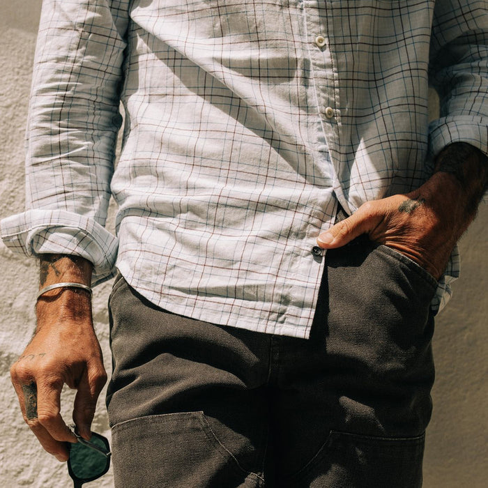 fit model showing off bottom detail on The Jack in Blue Fade Plaid