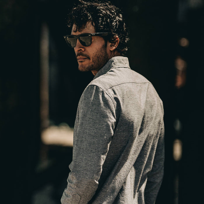 our fit model wearing The Jack in Charcoal Fleck—cropped shot of shoulder and back. Model looking left of screen