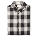 folded flatlay of The Jack in Coal Herringbone Check