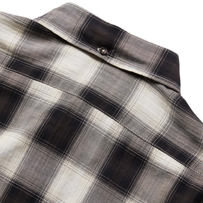 material shot of the back yoke of The Jack in Coal Herringbone Check
