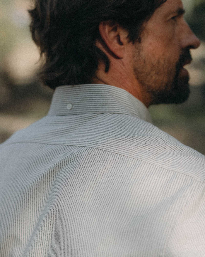 fit model showing off buttons on The Jack in Coal Jaspe University Stripe Oxford