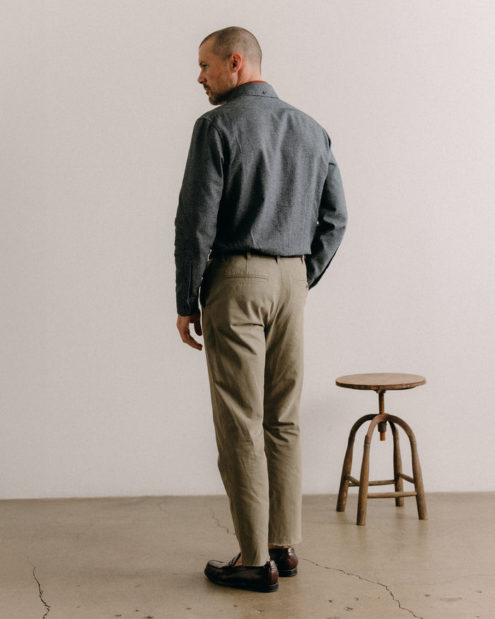 fit model sitting wearing The Jack in Dark Navy Houndstooth