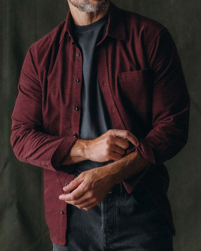 fit model adjusting the cuffs on The Jack in Heather Burgundy Pincord