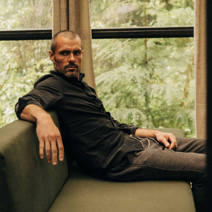 fit model sitting wearing The Jack in Heather Coal Pincord