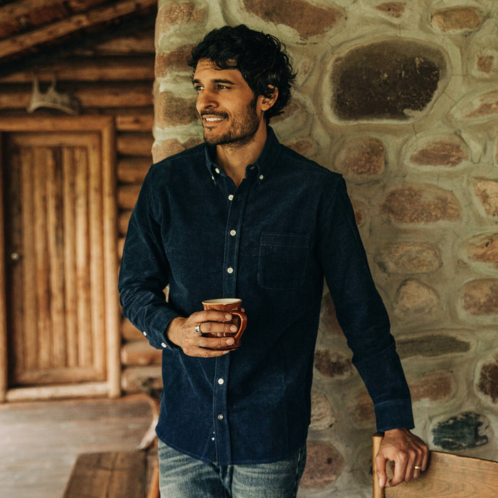 fit model wearing The Jack in Indigo Cord, holding coffee