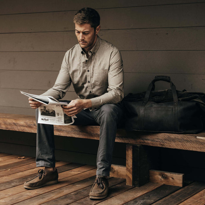 fit model sitting wearing The Jack in Khaki Houndstooth Check