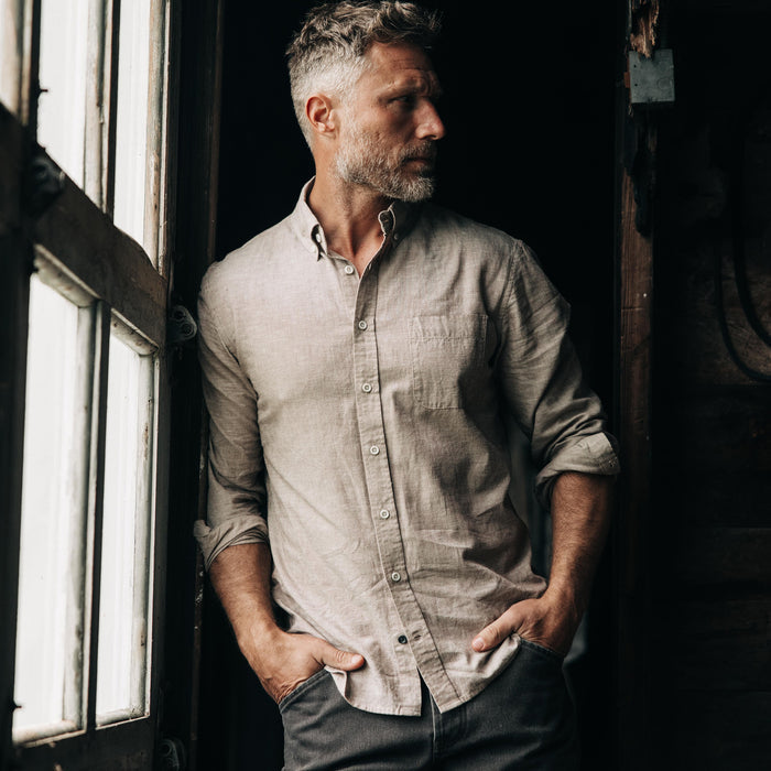 fit model leaning against the wall wearing The Jack in Merlot Slub Cotton Linen