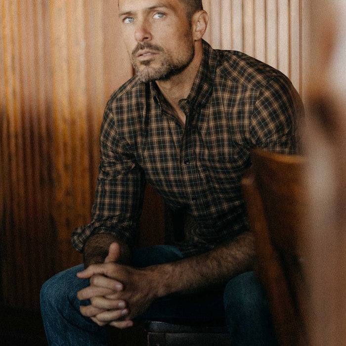 fit model sitting wearing The Jack in Mulch Plaid