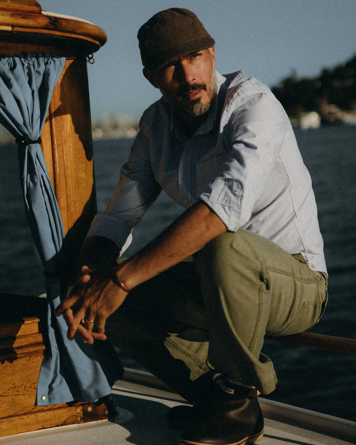 fit model adjusting his collar on The Jack in Navy University Stripe Everyday Oxford